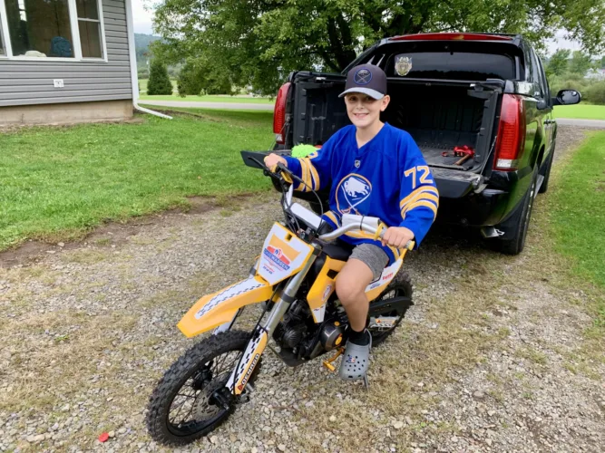 Dirt Bike Buddies: Busti youth receives surprise dirt bike from town supervisor